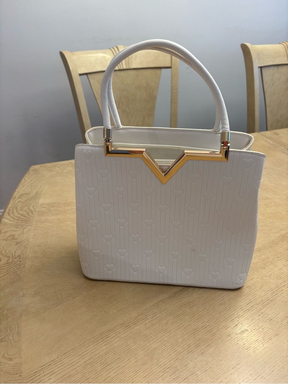 Elegant White Structured Tote Handbag with Gold Accents